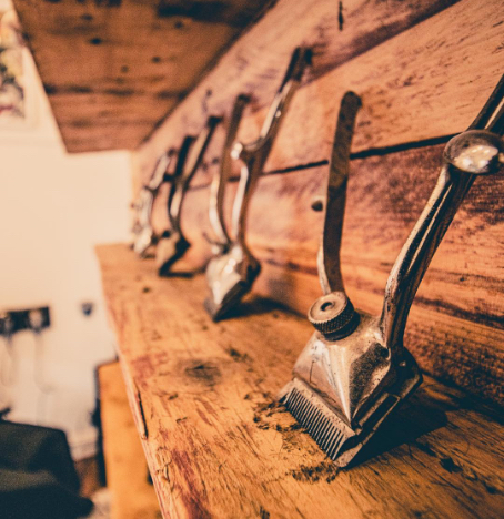 Haircut in progress at Alfie Allen